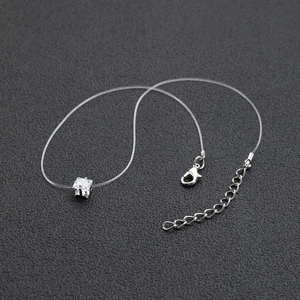 Detail of square zircon pendant with invisible fishing line and adjustable lobster clasp