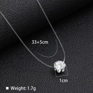 Macro shot of 1cm zircon pendant on invisible line necklace with 33+5cm dimensions