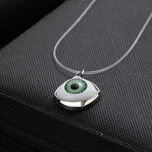 Invisible fishing line necklace with green evil eye pendant and silver metal frame