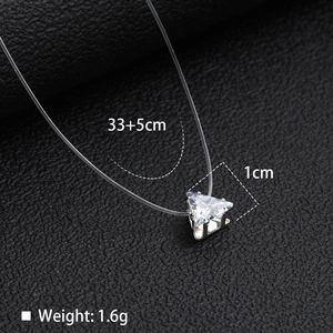 Macro detail of triangle zircon pendant on invisible line with 33+5cm length specs