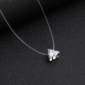 Minimalist invisible fishing line necklace with a triangular zircon pendant on black leather