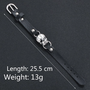Close-up of black leather skull bracelet showing buckle details and size dimensions