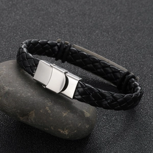 Men's braided black leather bracelet with silver steel clasp on dark stones
