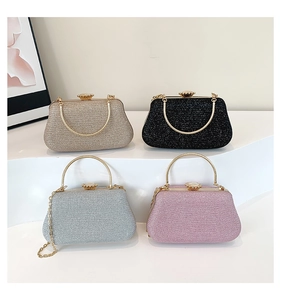 Collection of glittery evening bags in gold, silver, pink, and black with floral metal clasps