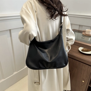 Minimalist black leather Hobo shoulder bag for women, perfect for daily commuting fashion