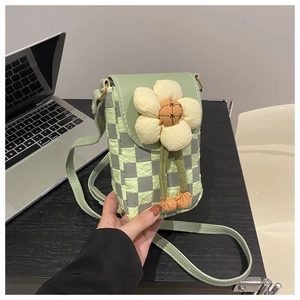 Mini crossbody phone bag with light green checkered pattern and decorative fabric flower