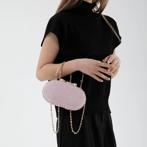 Pink glitter oval evening clutch with gold ring handle and chain strap for women