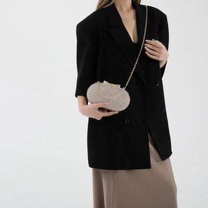 Chic gold glitter oval evening clutch bag with metal chain strap for formal occasions