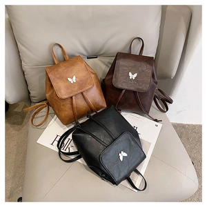 Three mini vintage PU leather backpacks in ginger, coffee, and black with butterfly buckle