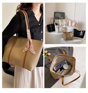 Spacious tote bag interior showing organization for tablet, umbrella and makeup