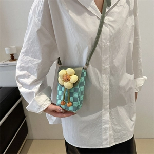 Mini mint green checkered crossbody phone bag with a cute plush flower decoration