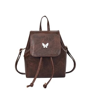 Brown vintage faux leather backpack for women with silver butterfly buckle and drawstring