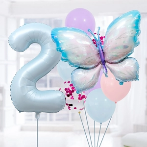 Detail of baby blue number 2 balloon with iridescent butterfly and macaron balloons