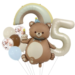 Detail view of bear balloon with number 5 and rainbow for birthday party decoration