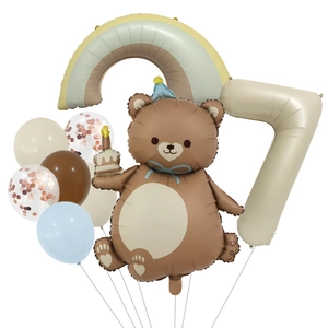 Detail of bear cake balloon and beige number 7 set for children birthday parties