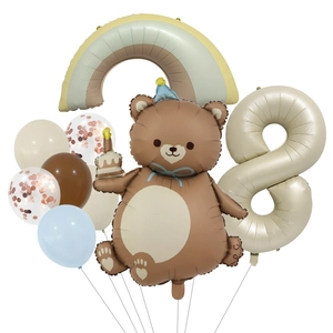 Detail of bear foil balloon and number 8 with matte rainbow bridge party kit