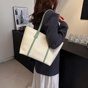 Minimalist cream and sage green tote bag for women showing spacious daily commute design