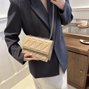 Chic beige quilted chain crossbody bag for women in a modern urban fashion style