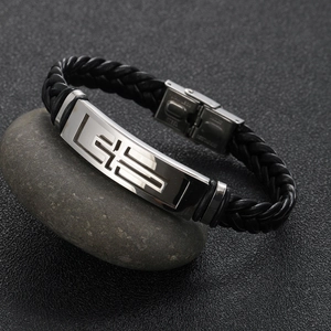 Men's braided leather bracelet with stainless steel cross plaque on dark pebbles