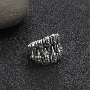 Gothic skull tooth ring in vintage punk style, silver-gray wide metal band with industrial relief