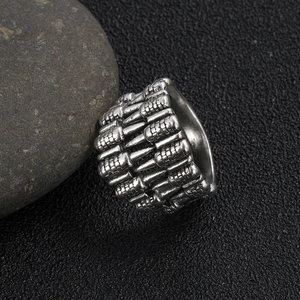 Detail of gothic bullet pattern ring on pebble with antique silver finish punk style