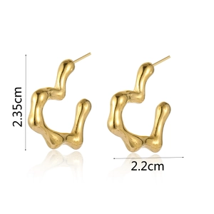 Detailed view of gold pleated heart earrings with measurement scale and smooth mirror finish
