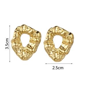Detail showing 3.5cm x 2.5cm size measurement for hammered gold irregular hoop earrings