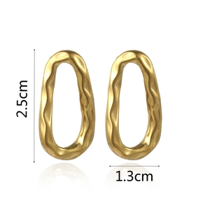 Detail view of gold textured hoop earrings showing 2.5cm height and 1.3cm width dimensions