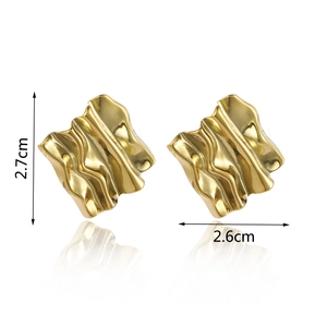 Detail view of gold textured steel earrings with 2.7cm by 2.6cm dimensions