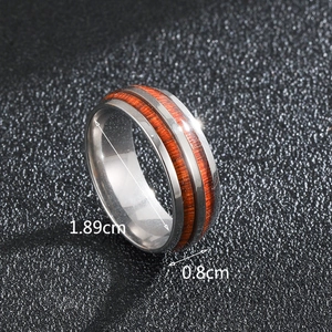 Close-up of men's steel ring with wood inlay showing 8mm width and 1.89cm diameter