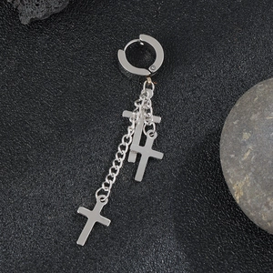 Gothic stainless steel huggie earrings with chain and triple cross charms on a dark stone base