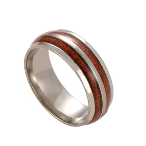 Polished stainless steel men's ring with vintage wood grain inlay and metallic shine