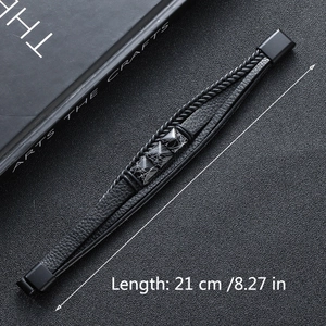 Detail of multi-layer braided black leather bracelet with marble-effect accents, 21 cm length