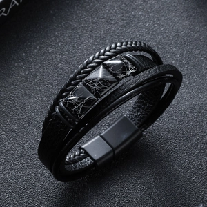 Detail showing multi-layer braided leather bracelet with marble stone and magnetic clasp