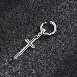 Classic silver cross drop earrings in punk style with textured relief on black background