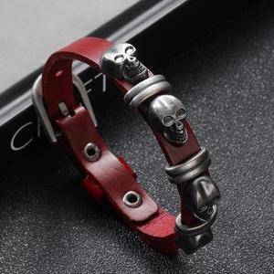 Punk style red leather skull bracelet with vintage metal charms and buckle closure