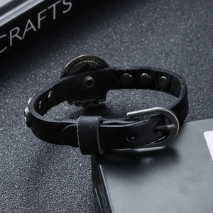 Punk style black leather bracelet with vintage alloy badge and adjustable pin buckle