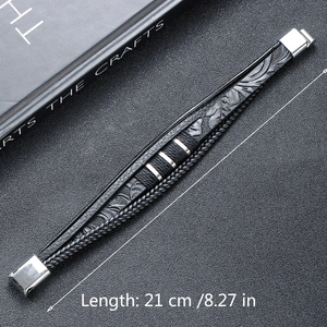 Close-up of black braided leather bracelet with silver magnetic buckle and 21cm length