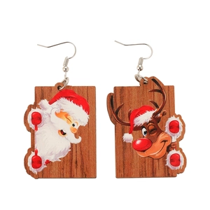 Creative wooden Christmas earrings featuring cartoon Santa Claus and reindeer on white background
