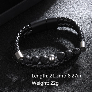 Detail of men's leather braided bracelet with lava stone beads and magnetic clasp