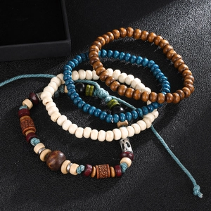 Retro multi-layer wooden bead bracelet set with woven rope and ethnic metal charms