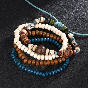 Detail view of multi-layer wood beads set with vintage bohemian ethnic patterns