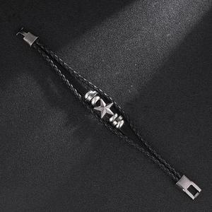 Vintage multilayer black leather woven bracelet featuring a silver star and magnetic clasp