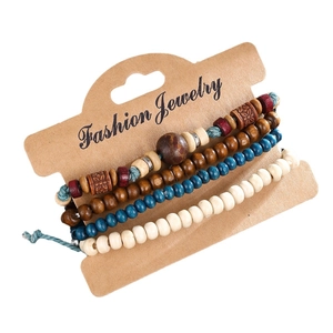 Bohemian multi-layer wooden beaded bracelet set with vintage ethnic charms on display card