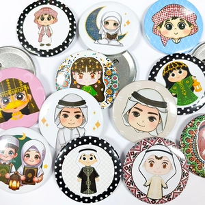 Detailed view of Middle Eastern themed tinplate badges with cartoon figures and moon motifs