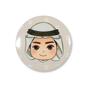 Close-up of Middle Eastern party tinplate badge featuring a cute cartoon character design