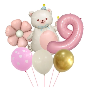 Detail of bear foil balloon with daisy and pink number nine for kids birthday party