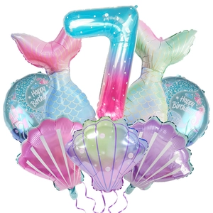 Detailed view of mermaid theme 7th birthday balloon set with shells and foil number
