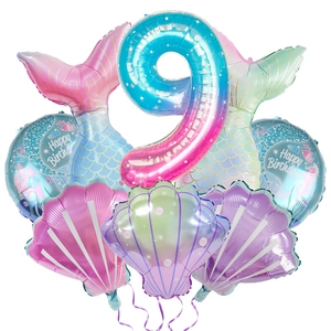Detail view of mermaid theme balloon set with gradient number 9 and colorful shells