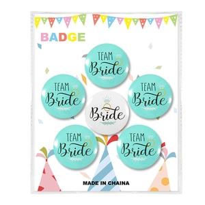Detail view of 6-piece tinplate badges including Bride and Team Bride for wedding parties